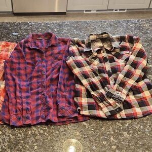 Two women's Eddie Bauer flannel shirts size small.